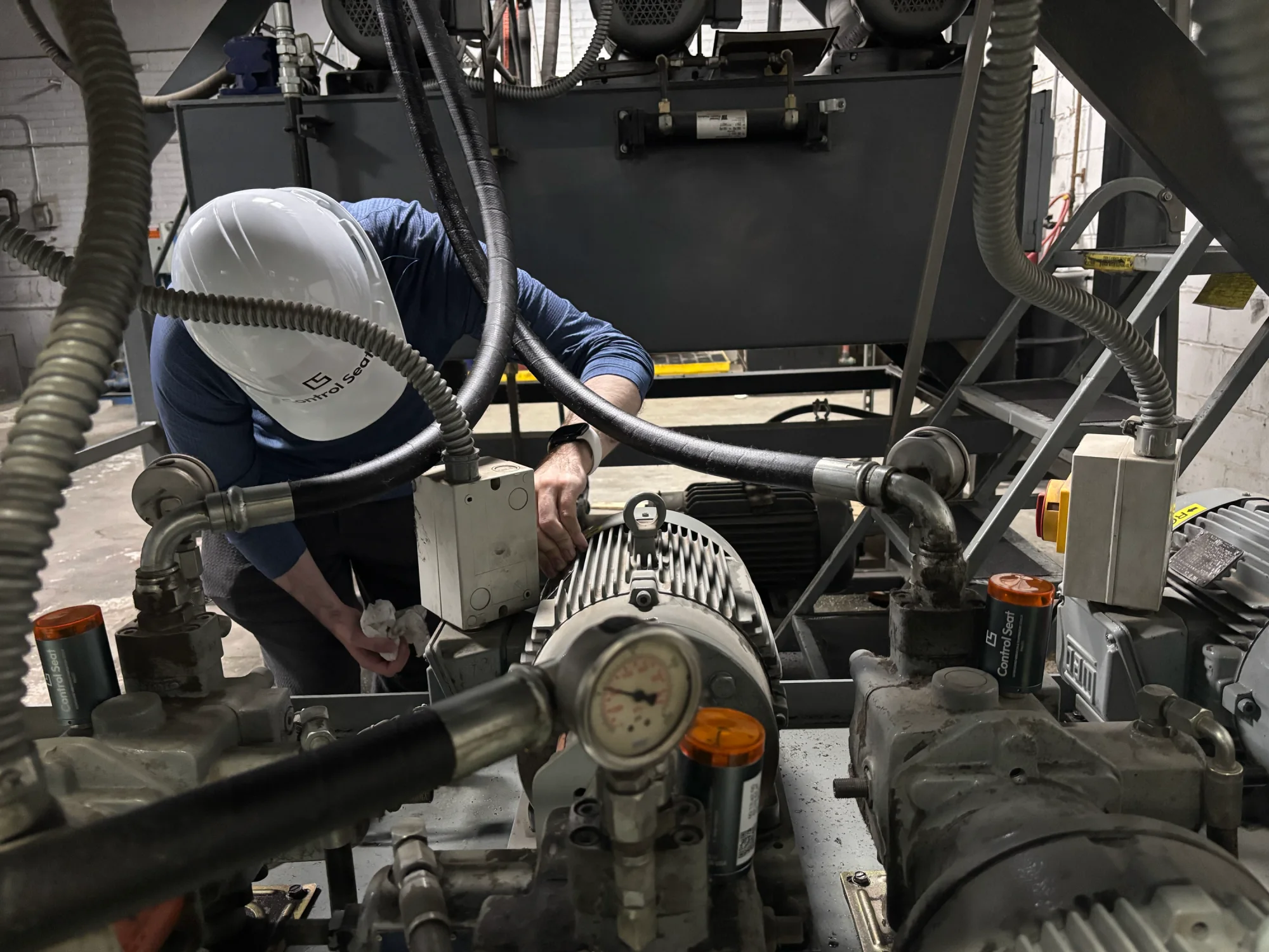 Installing Control Seat sensors on manufacturing equipment